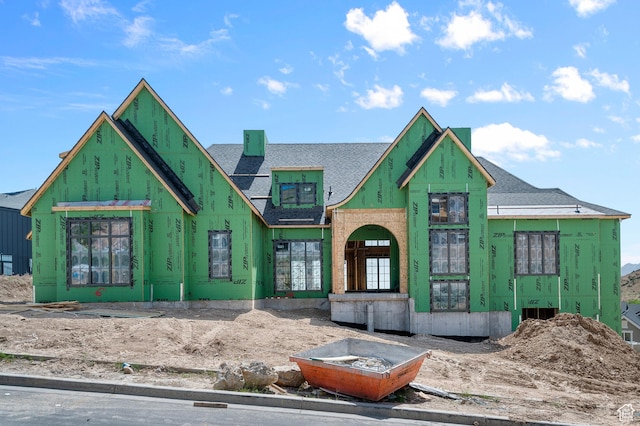 property under construction featuring a shingled roof