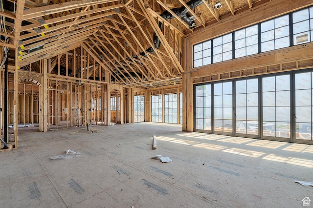 misc room with plenty of natural light and high vaulted ceiling