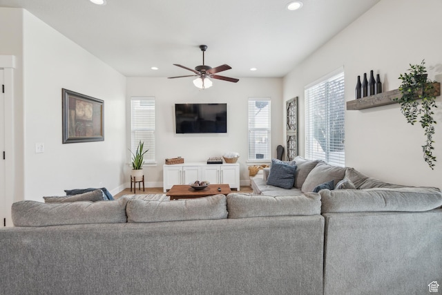 living room featuring a ceiling fan, recessed lighting, and baseboards