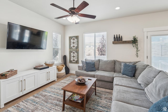 living room featuring ceiling fan, wood finished floors, recessed lighting, and baseboards