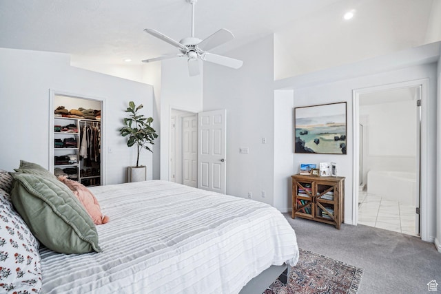 carpeted bedroom with a spacious closet, connected bathroom, recessed lighting, a closet, and ceiling fan