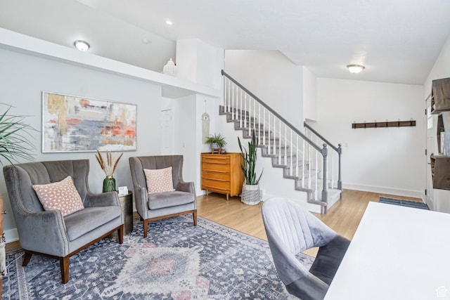 office featuring wood finished floors, lofted ceiling, baseboards, and recessed lighting