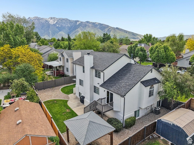 aerial view of residential area featuring a mountain backdrop