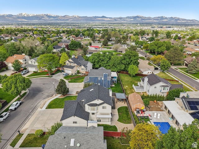 aerial perspective of suburban area featuring a mountain backdrop