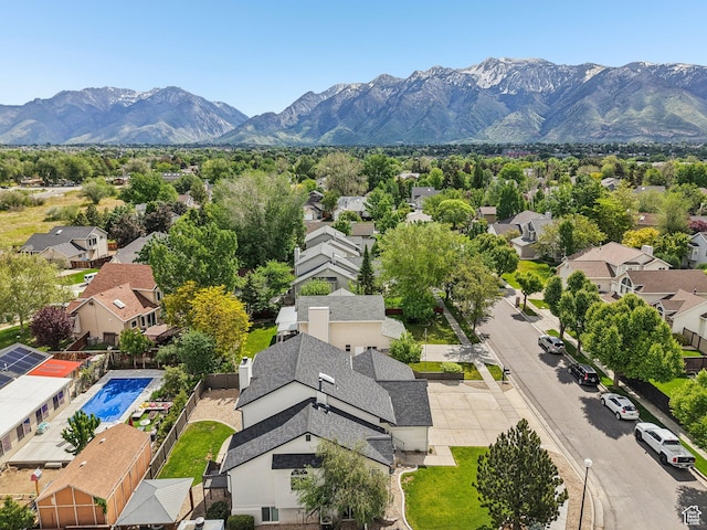aerial perspective of suburban area featuring a mountain backdrop