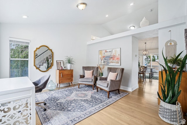 home office featuring vaulted ceiling, light wood-type flooring, a chandelier, recessed lighting, and baseboards