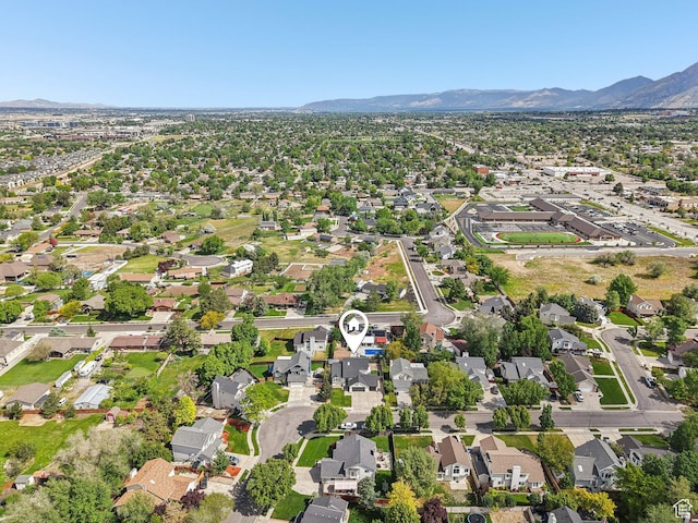 aerial view of residential area featuring a mountain backdrop