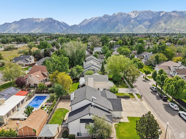 aerial perspective of suburban area featuring a mountain backdrop