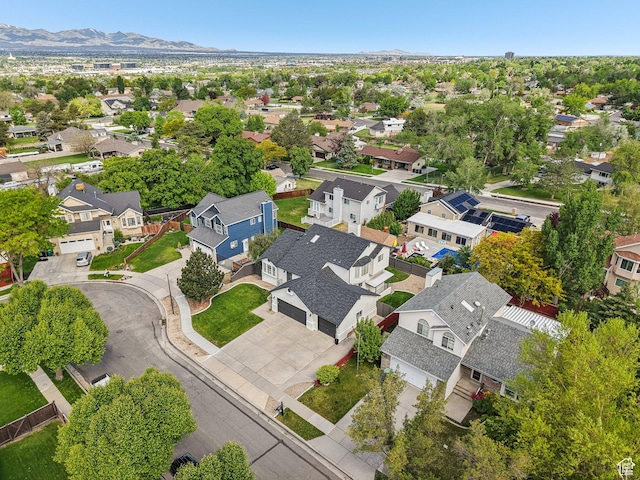 aerial view of residential area featuring a mountainous background
