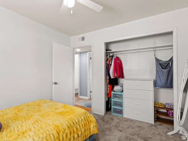 bedroom featuring a closet, carpet flooring, and a ceiling fan