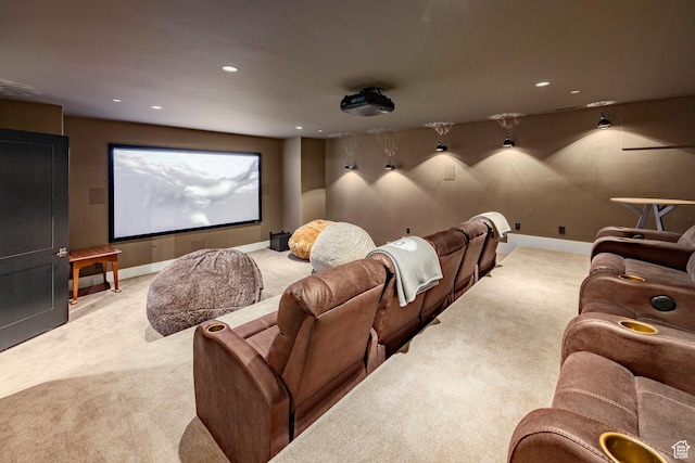 carpeted cinema room with recessed lighting and baseboards