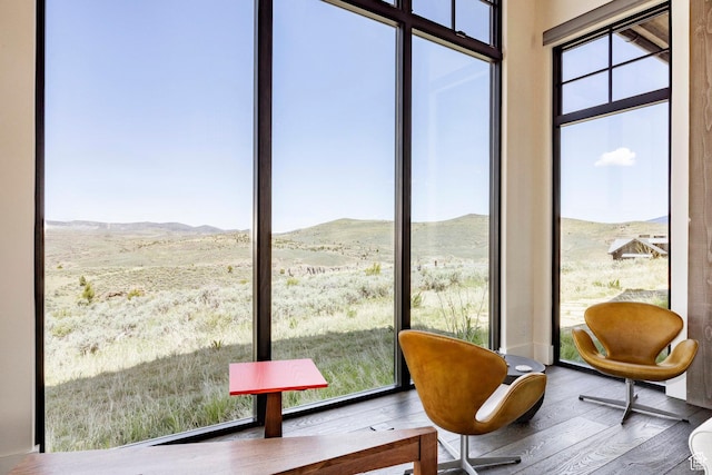 sunroom with a mountain view