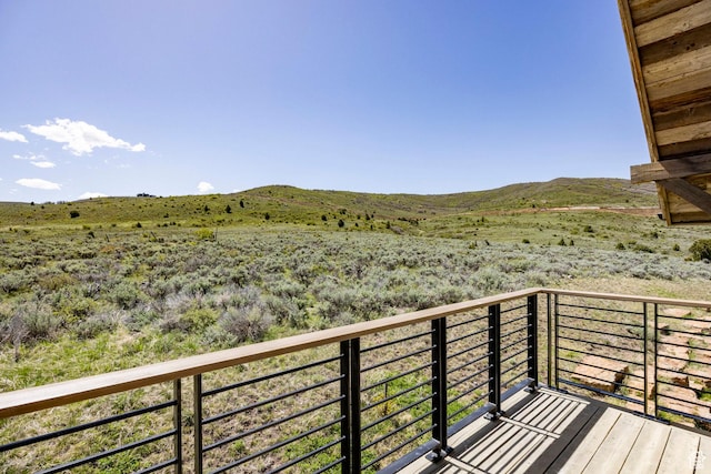 balcony featuring a mountain view