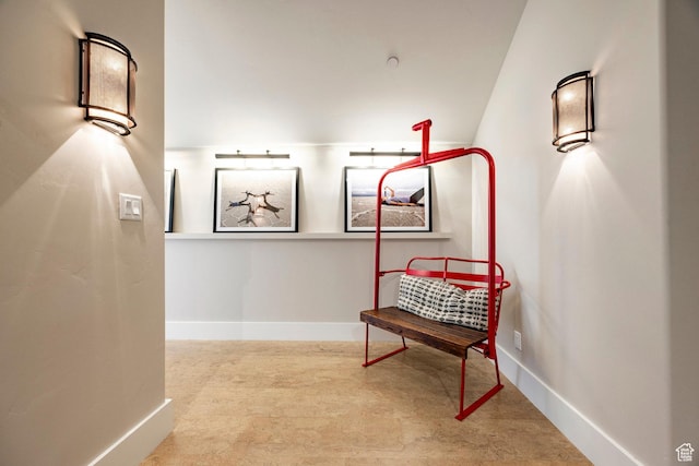 hallway featuring baseboards