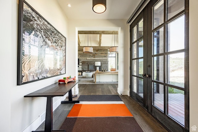 hallway featuring wood finished floors, french doors, and recessed lighting