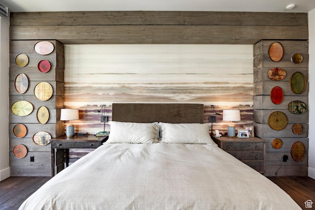 bedroom featuring dark wood-style flooring