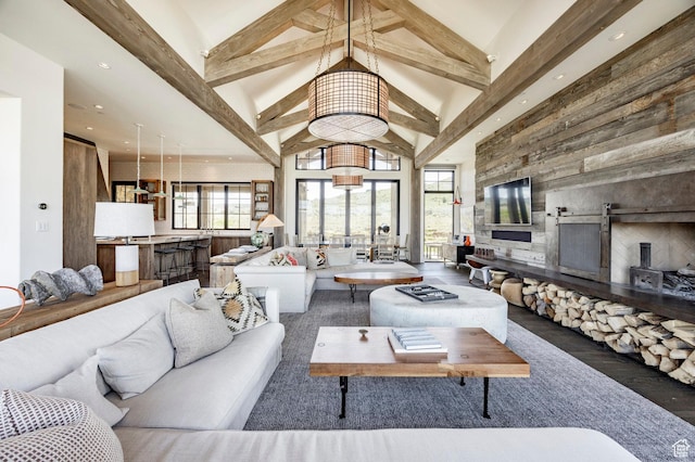 living room featuring high vaulted ceiling, beam ceiling, wood finished floors, and recessed lighting