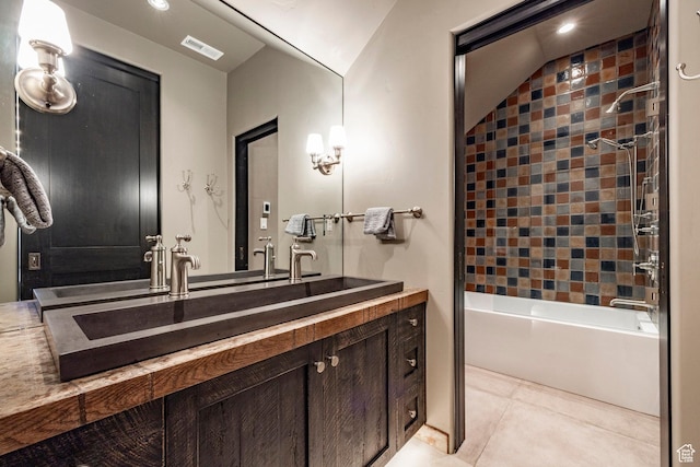 bathroom featuring tile patterned flooring, vanity, bathtub / shower combination, and recessed lighting