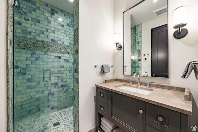 full bath featuring a shower stall and vanity