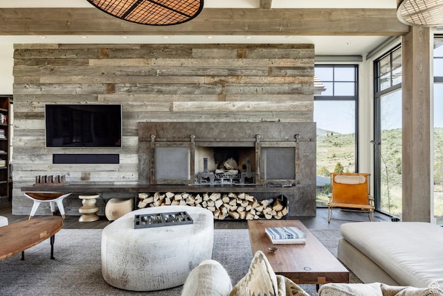 living area featuring recessed lighting, wood finished floors, and a fireplace