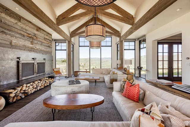 living area featuring high vaulted ceiling, beamed ceiling, wood finished floors, and recessed lighting