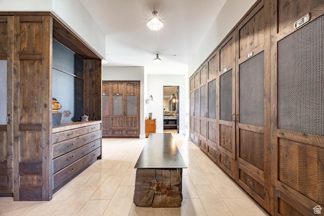 hallway with light tile patterned floors