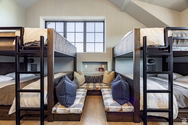 bedroom with lofted ceiling