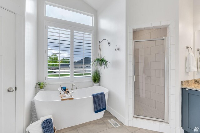 3106 N Eagle Way, Lehi, UT 84043 - bathroom with a shower stall, tile patterned flooring, a soaking tub, vanity, and baseboards