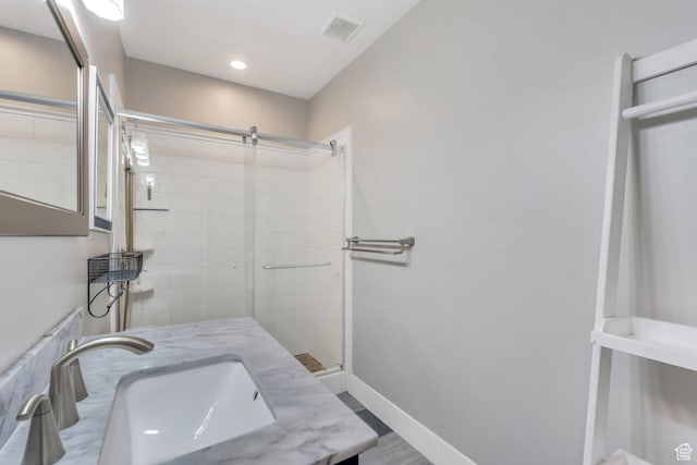 full bath with a shower stall, baseboards, recessed lighting, and vanity