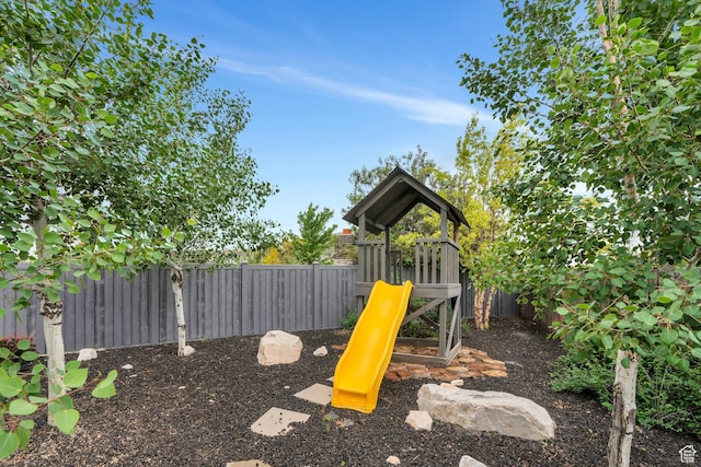 view of playground with a fenced backyard