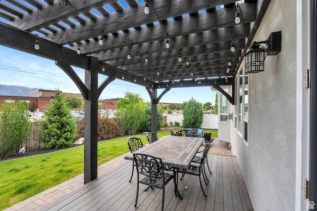 wooden deck featuring a pergola and outdoor dining area