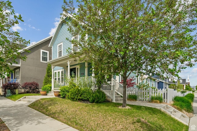 view of front of home with covered porch and stucco siding
