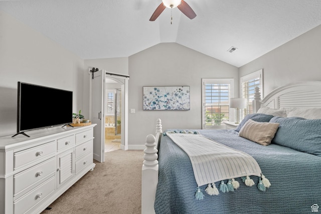 bedroom featuring light carpet, lofted ceiling, baseboards, and a ceiling fan