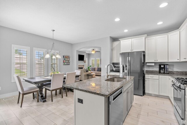 10426 S Kestrel Rise Rd, South Jordan, UT 84009 - kitchen with appliances with stainless steel finishes, a sink, plenty of natural light, a ceiling fan, and recessed lighting