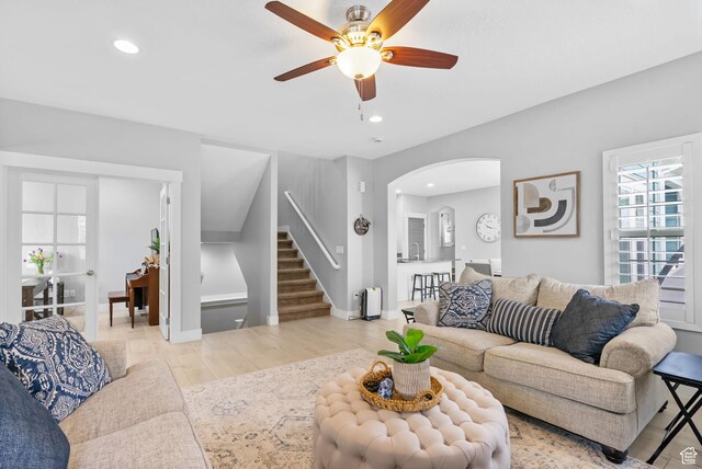 10426 S Kestrel Rise Rd, South Jordan, UT 84009 - living area featuring stairs, ceiling fan, arched walkways, light wood-style floors, and recessed lighting