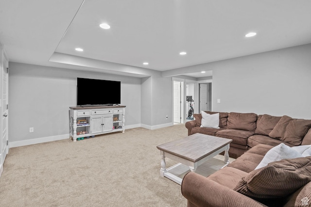 living room featuring recessed lighting, light colored carpet, and baseboards