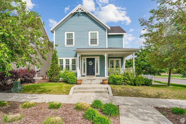 traditional-style house featuring covered porch