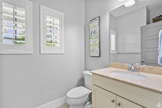 bathroom featuring toilet and vanity