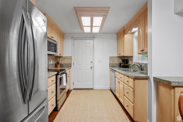 7479 S Randall Cir, Midvale, UT 84047 - kitchen with appliances with stainless steel finishes, a sink, decorative backsplash, light brown cabinets, and baseboards