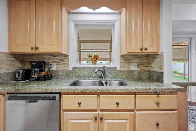 7479 S Randall Cir, Midvale, UT 84047 - kitchen featuring stainless steel dishwasher, a sink, light brown cabinetry, and light countertops
