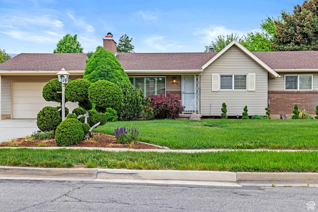 7479 S Randall Cir, Midvale, UT 84047 - single story home featuring an attached garage, a chimney, brick siding, a front lawn, and driveway