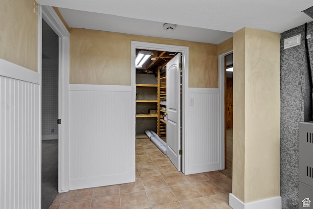 7479 S Randall Cir, Midvale, UT 84047 - hallway featuring wainscoting and light tile patterned flooring