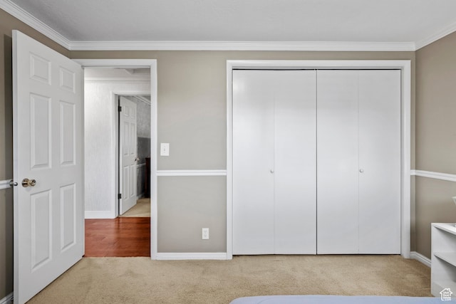7479 S Randall Cir, Midvale, UT 84047 - unfurnished bedroom featuring carpet floors, ornamental molding, a closet, and baseboards