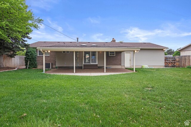 7479 S Randall Cir, Midvale, UT 84047 - back of house featuring a patio area, central air condition unit, and brick siding