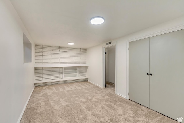 unfurnished bedroom with carpet, baseboards, and a closet