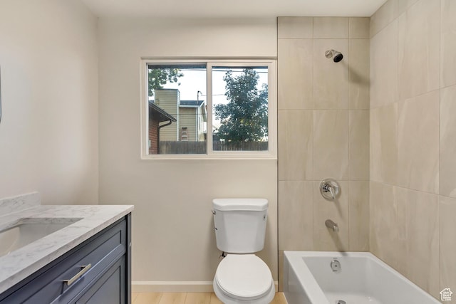 full bathroom with vanity, bathing tub / shower combination, toilet, and baseboards