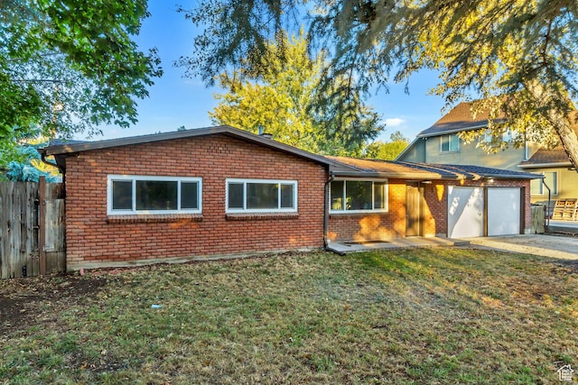 view of front facade with brick siding, an attached garage, and concrete driveway