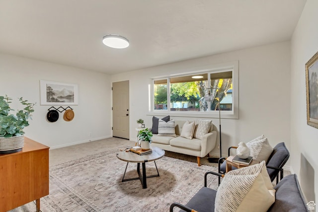 living room featuring carpet floors and baseboards