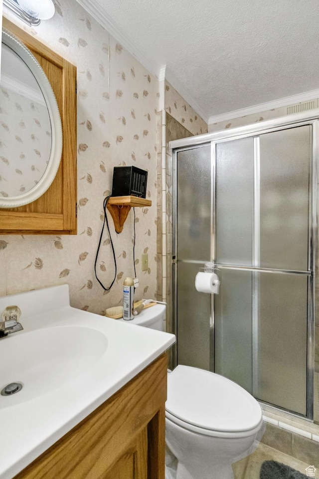 full bathroom with wallpapered walls, ornamental molding, a shower stall, toilet, and vanity