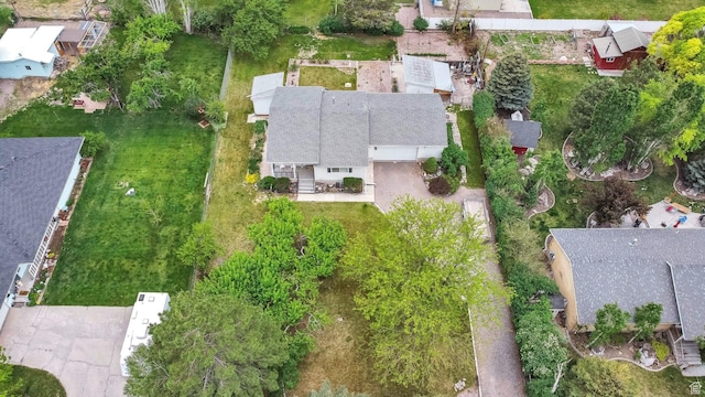 aerial view of property and surrounding area featuring nearby suburban area